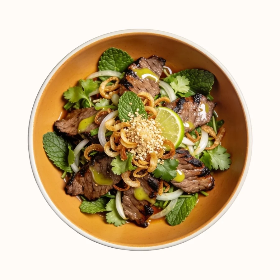 Nam Tok (Grilled Steak Salad), plated, photographed from above.