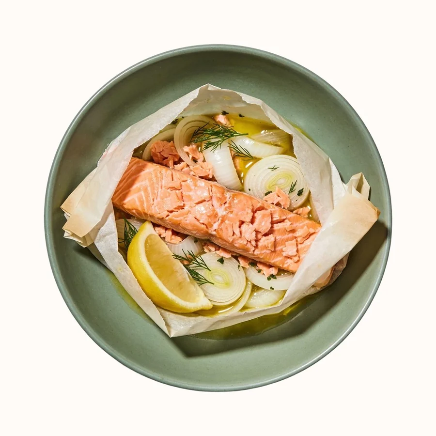 Salmon en Papillote, plated, photographed from above.